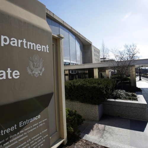 FILE PHOTO: People enter the State Department Building in Washington, U.S., January 26, 2017. REUTERS/Joshua Roberts/File Photo