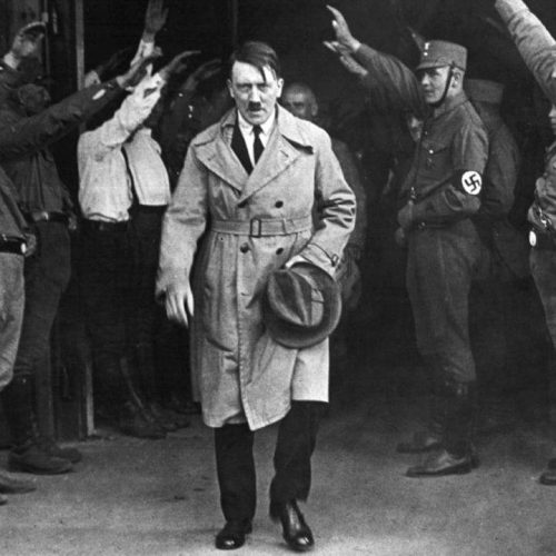 Adolf Hitler, leader of the National Socialists, emerges from the party's Munich headquarters on December 5, 1931.  Hitler predicted his Nazi party would one day control Germany. (AP Photo)