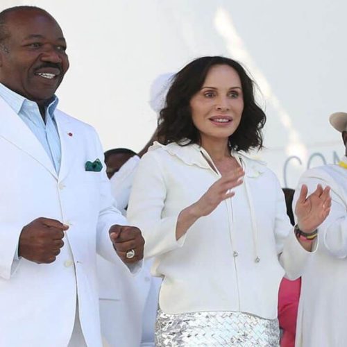 (FILES) Gabon President Ali Bongo Ondimba (L) and Gabon First Lady Sylvia Bongo Ondimba (C) are seen at the Nzang Ayong stadium in Libreville on July 10, 2023, a day after he announced that he would seek a third term as the oil-rich African nation's head of state. Lawyers for Sylvia Bongo, the Gabonese-French wife of President Ali Bongo Ondimba, placed under house arrest by soldiers who deposed him in a coup on August 30, 2023, filed a complaint in France on September 1, 2023 for arbitrary detention, François Zimeray and Jessica Finelle told AFP. (Photo by Steeve JORDAN / AFP)